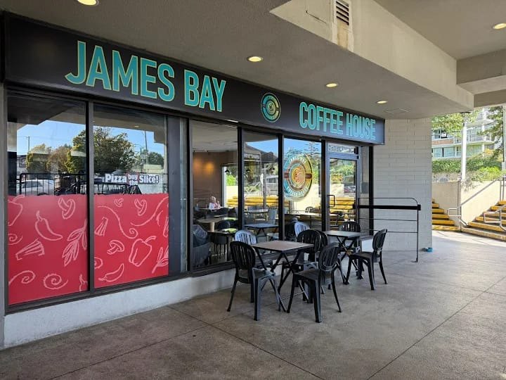 The front of James Bay Coffee House, with tables and chairs outside